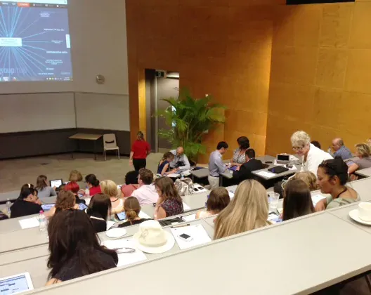 Participants in a lecture room with a GroupMap mind map projected on screen
